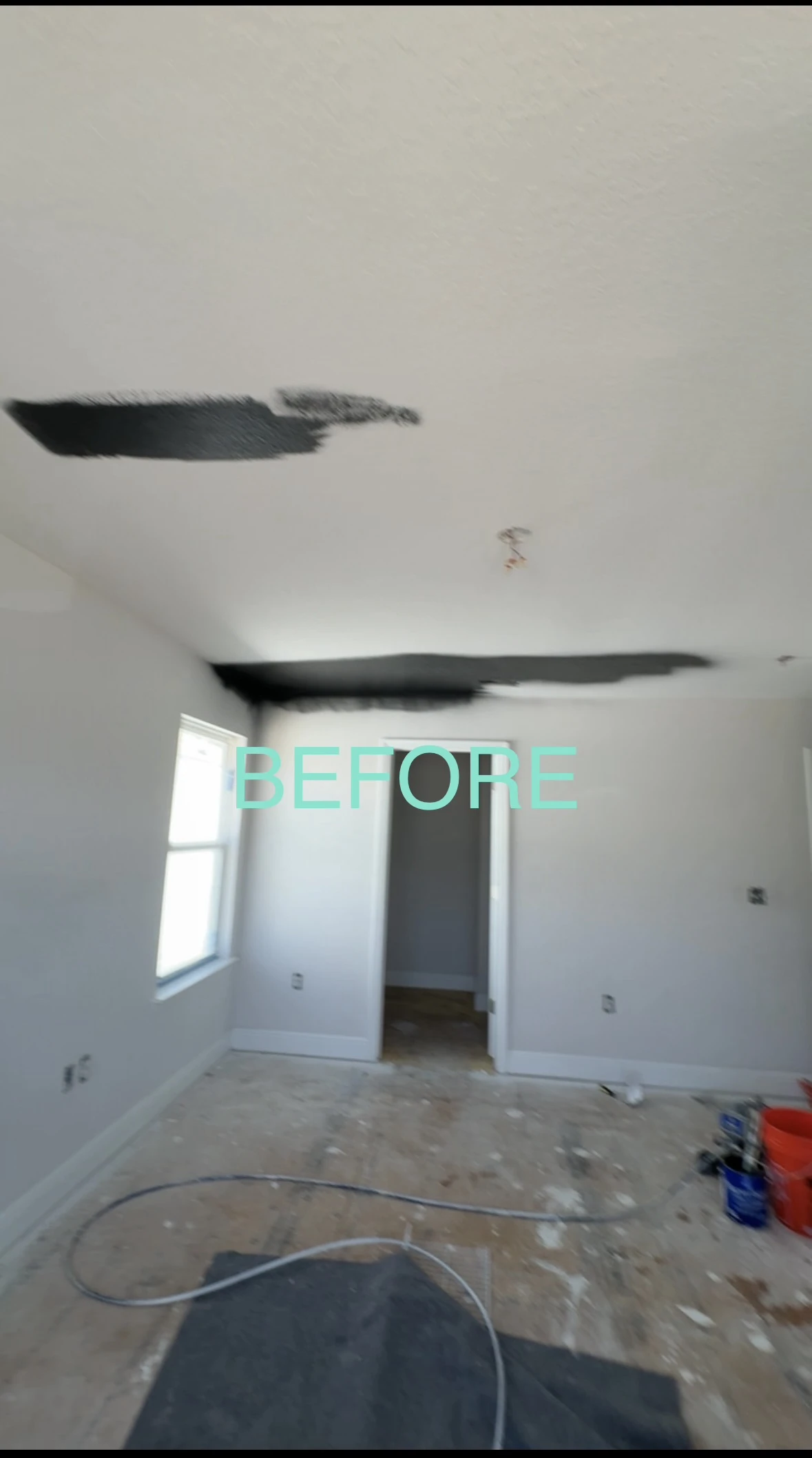 Bedroom before painting during renovation prep with test swatches