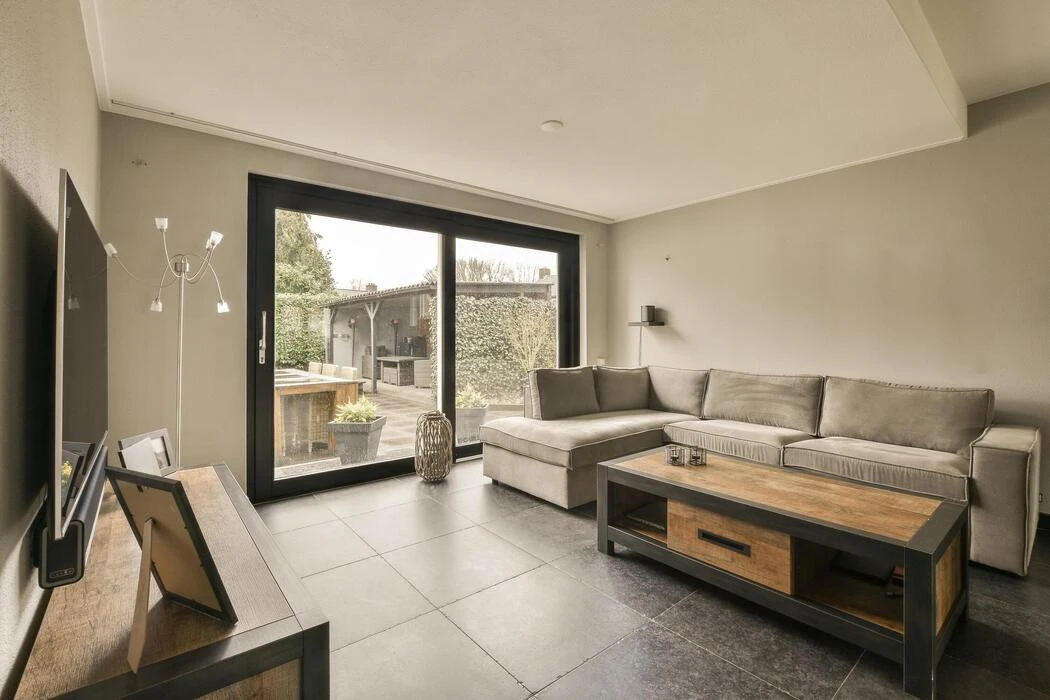 Coastal living room with clean interior paint and sliding glass doors