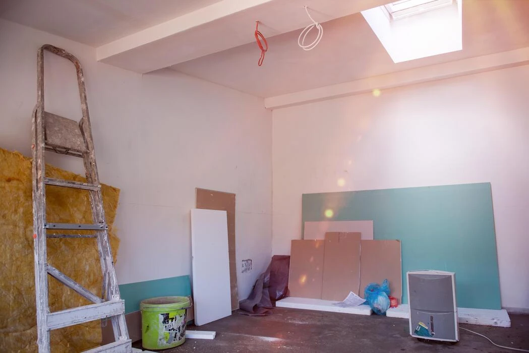 Interior drywall prep site with natural light